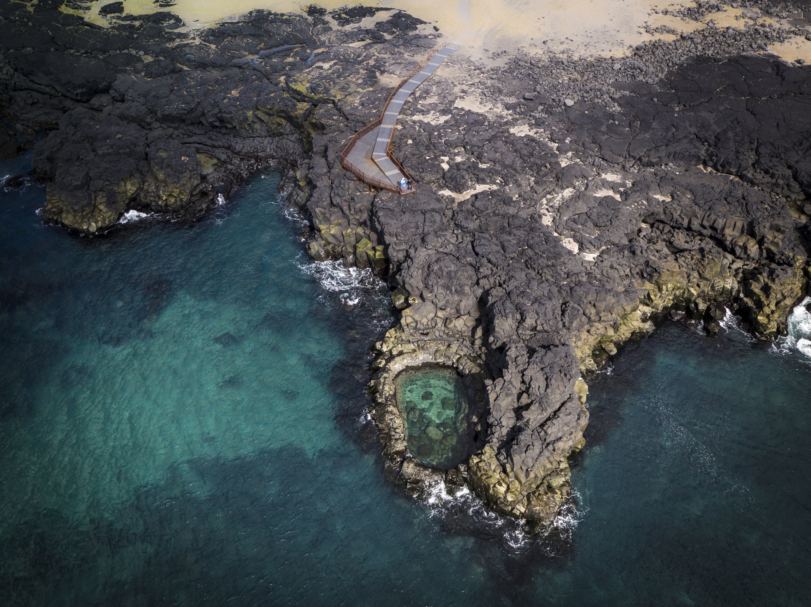 Brimketill, a small body of water contained in Iceland's rocky shoreline