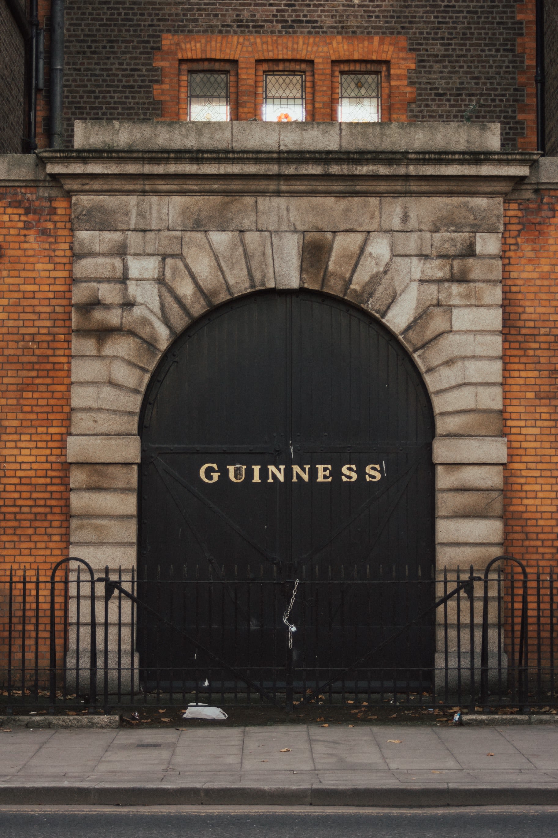 the arched stonebuilt entrance to a Guiness brewery in Dublin