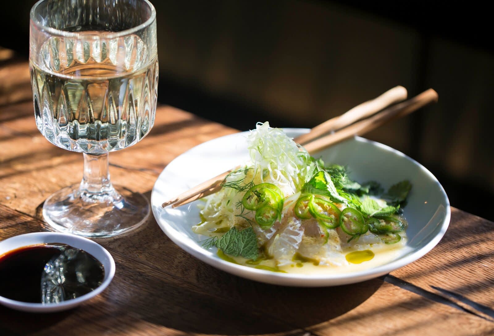 A sushi fish dish served with greens at Nord Austur in Seydisfjordur