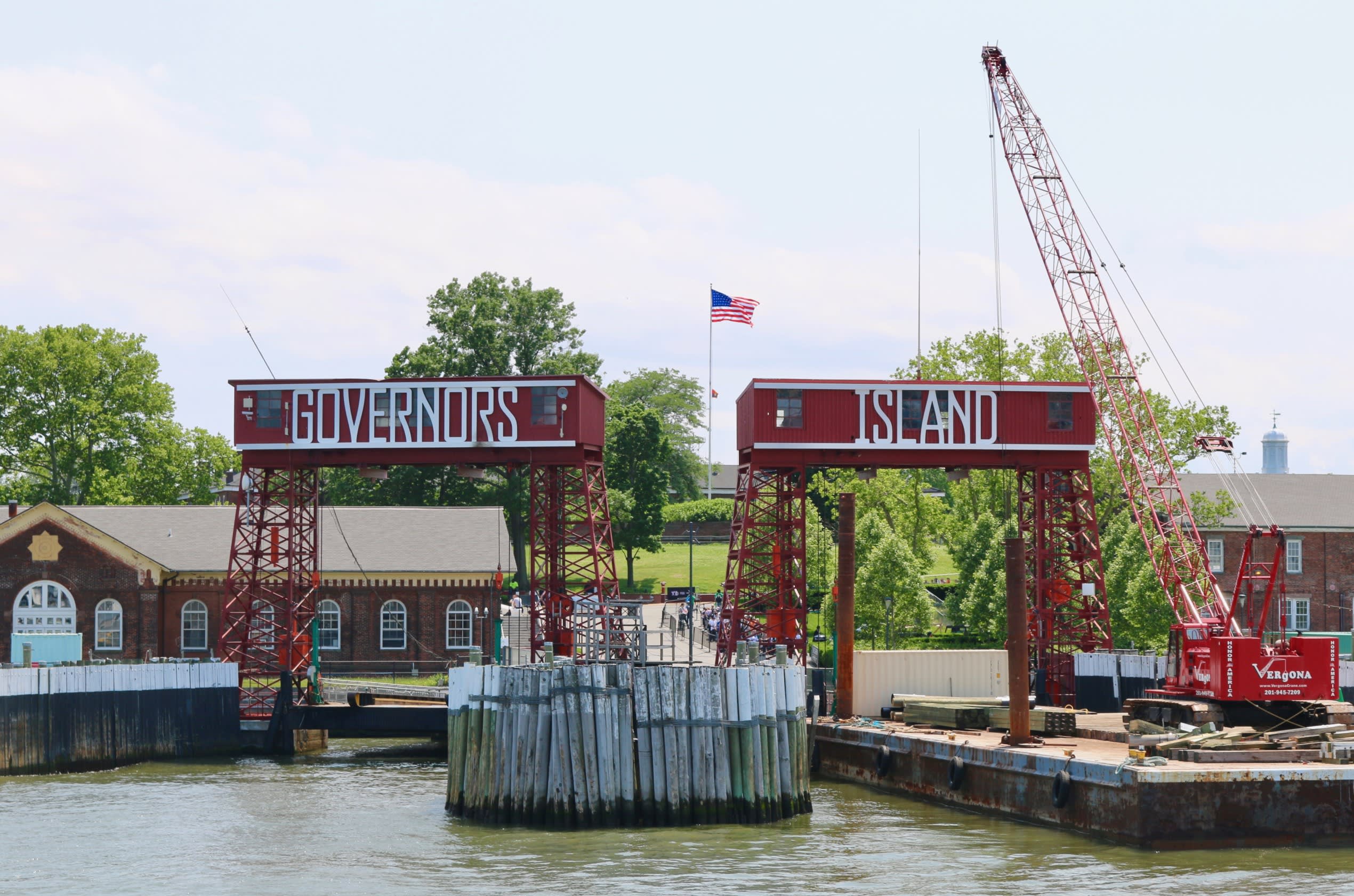 a barge in the US with two overhead signs, one that reads 'Governors' and the other that reads 'Island'
