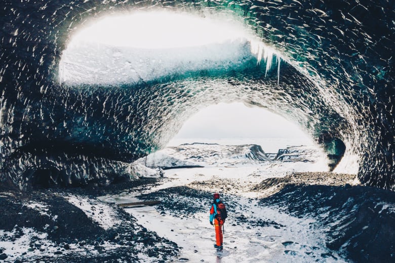 solo-travel-person-ice-cave