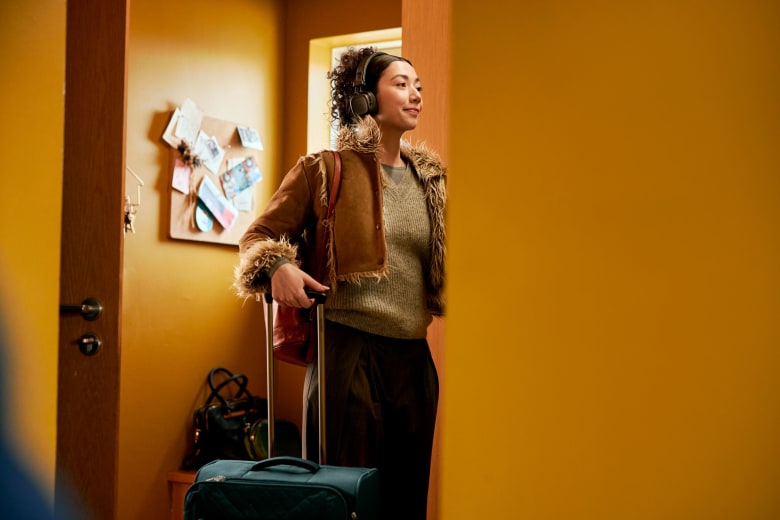 Woman with bag and headphones