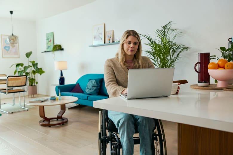 Woman in wheelchair - computer